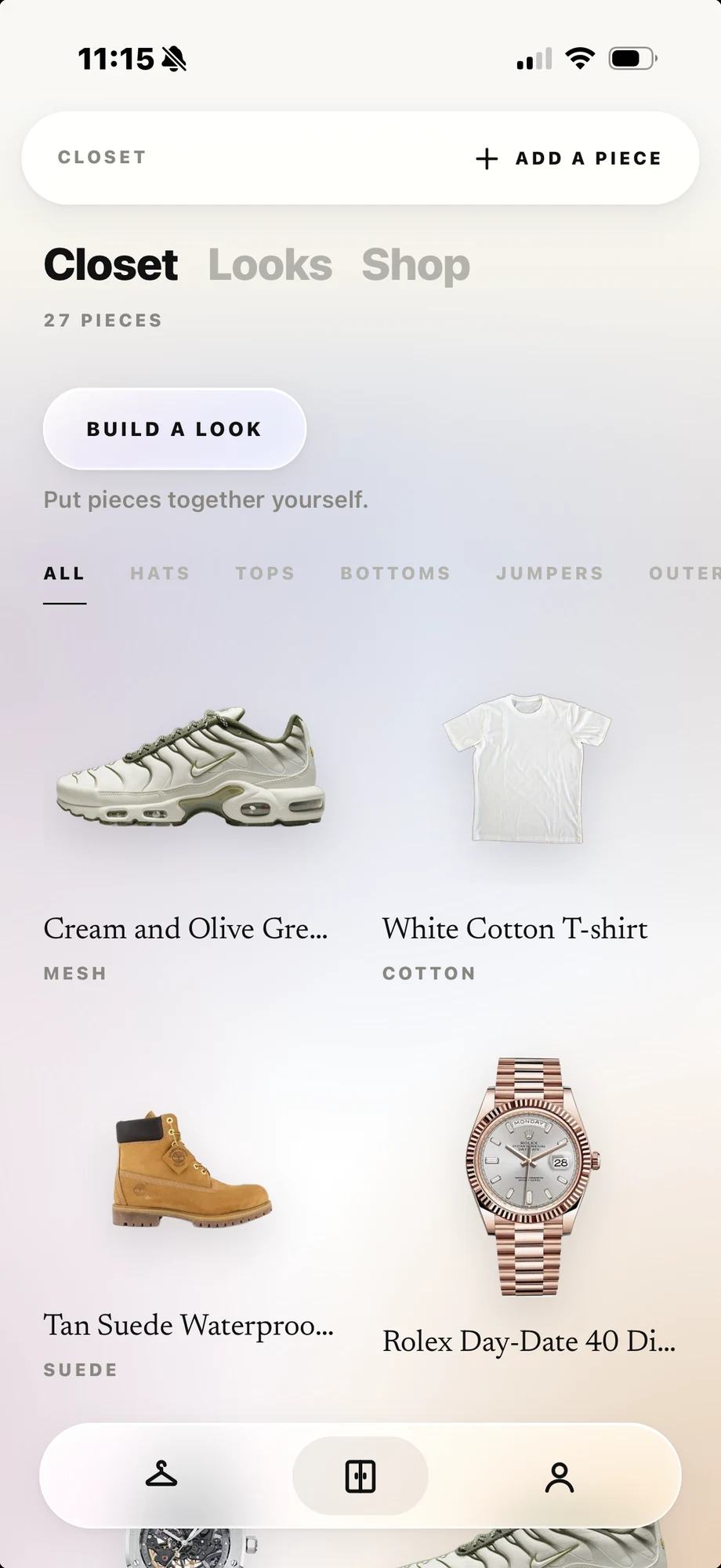 The Vestis closet: trainers, a white tee, boots and a watch, each cut out clean
